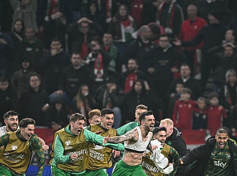 Ireland's forward #07 Troy Parrott (C) celebrates his 2-3 during the FIFA World Cup 2026 Group F European qualification football match betweem Hungary and Republic of Ireland at the Puskas Arena in Budapest, Hungary on Novemeber 16, 2025.