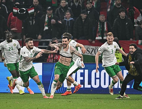 Ireland's forward #07 Troy Parrott (C) celebrates his 2-3 during the FIFA World Cup 2026 Group F European qualification football match betweem Hungary and Republic of Ireland at the Puskas Arena in Budapest, Hungary on Novemeber 16, 2025.
