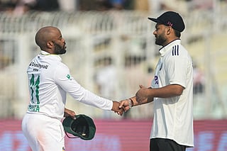 South Africa's captain Temba Bavuma (L) is congratulated by India's Rishabh Pant for his team's victory at the end of the third day of the first Test cricket match between India and South Africa in the Eden Gardens of Kolkata on November 16, 2025.