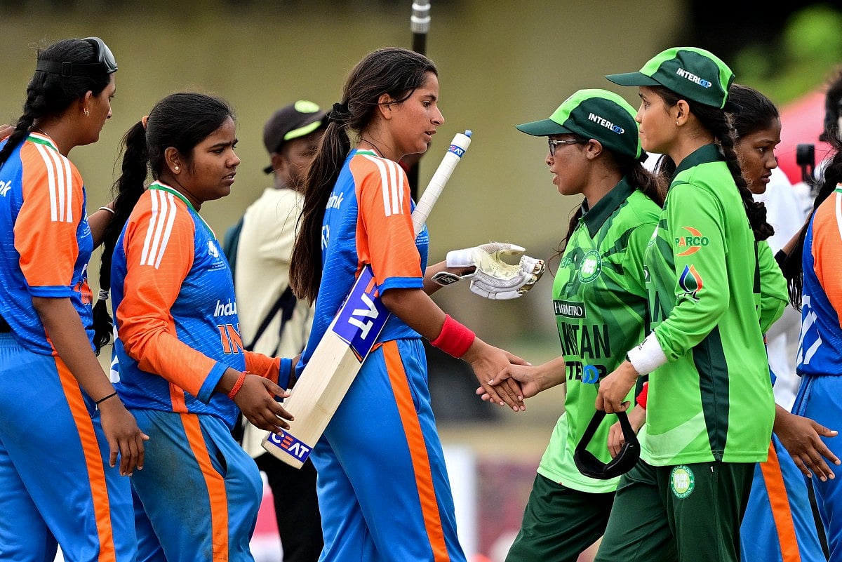 Pakistan's captain Nimra Rafique (3R) shakes hands with India's players at the end of the Women’s Blind Twenty20 World Cup 2025 match between India and Pakistan at the BOI Cricket Stadium in Katunayake on November 16, 2025.