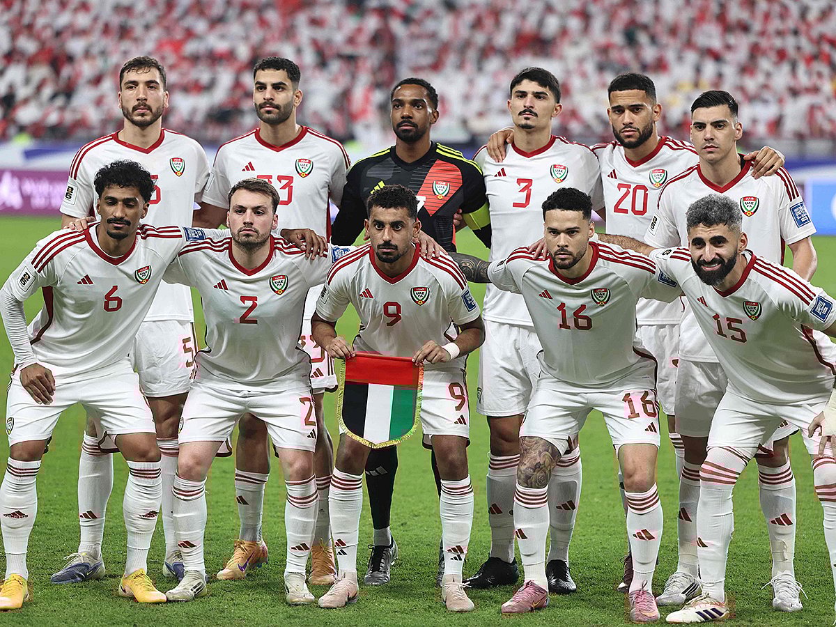 UAE players stand for a group picture ahead of the FIFA World Cup 2026 Asian qualifier football match against Iraq at the Mohammed bin Zayed Stadium in Abu Dhabi on November 13, 2025.