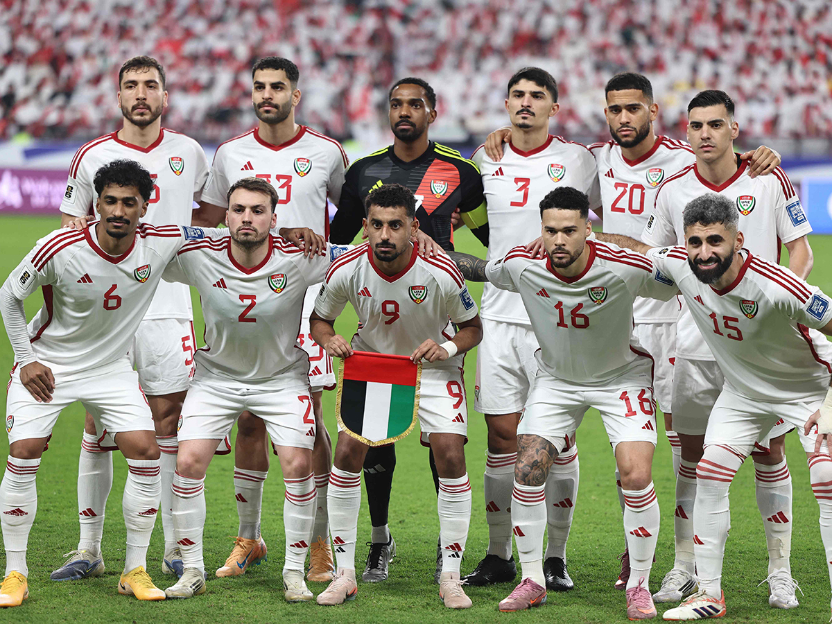 UAE players stand for a group picture ahead of the FIFA World Cup 2026 Asian qualifier football match against Iraq at the Mohammed bin Zayed Stadium in Abu Dhabi on November 13, 2025. 