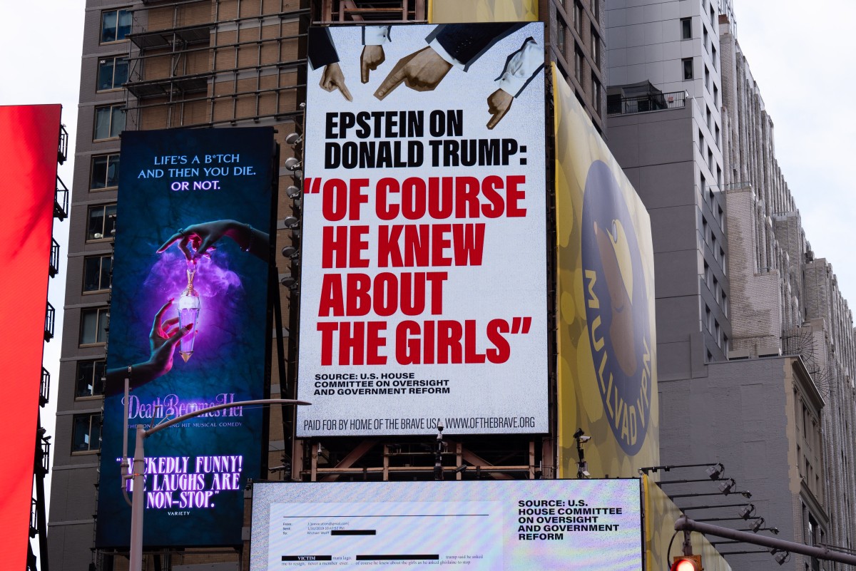 A billboard in Times Square, paid for by the group Home of the Brave, highlights Jeffrey Epstein's comment that Donald Trump "of course he knew about the girls", on November 17, 2025 in New York City.