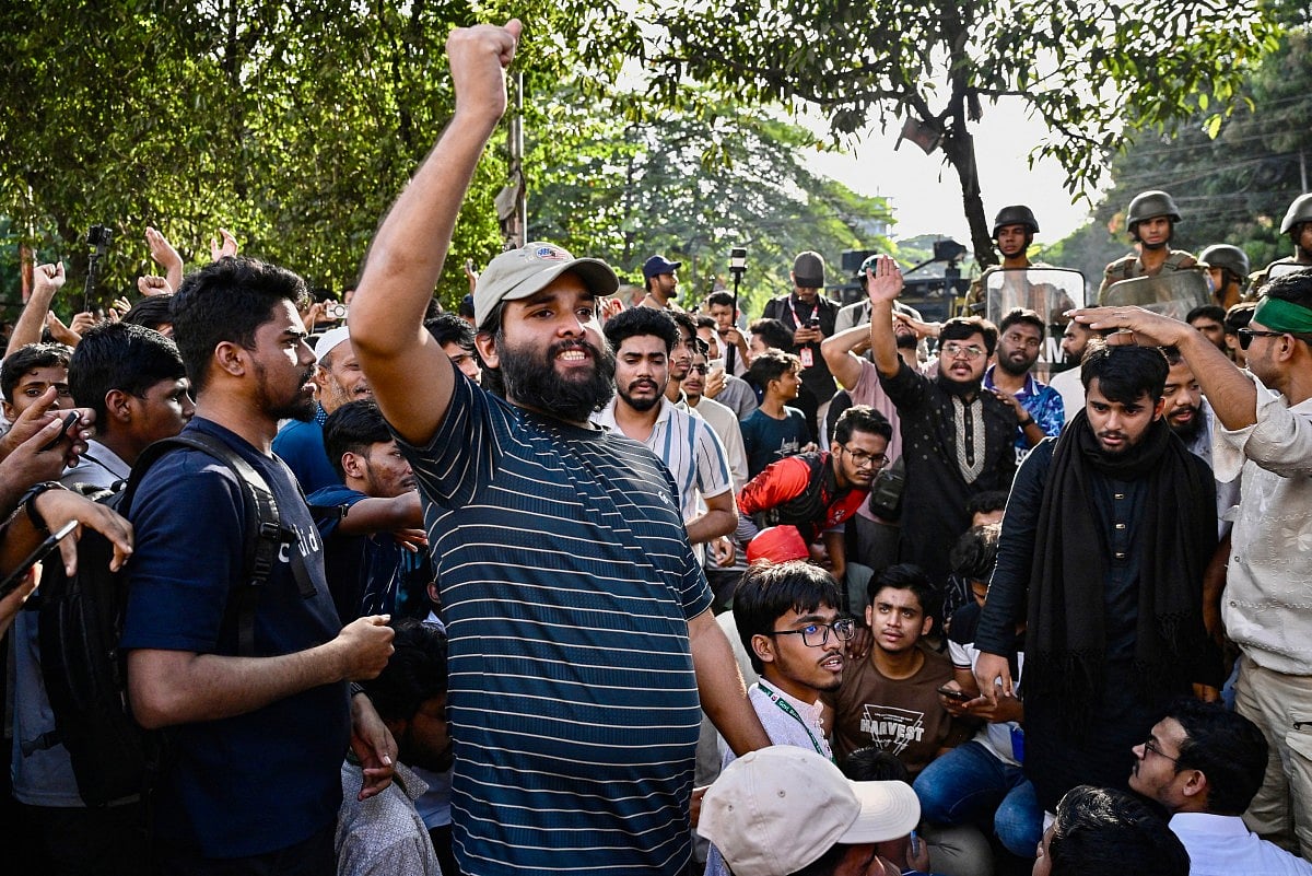 People celebrate the court's verdict after Bangladesh's former Prime Minister Sheikh Hasina was found guilty and sentenced to death in Dhaka on November 17, 2025.