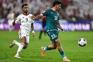 Iraq's defender #23 Merchas Doski vies for the ball with UAE's midfielder #9 Harib Abdalla during the FIFA World Cup 2026 Asian qualifier football match between the United Arab Emirates and Iraq at the Mohammed bin Zayed Stadium in Abu Dhabi on November 13, 2025.