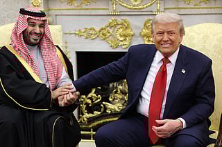 President Donald Trump (R) takes the hand of Crown Prince and Prime Minister Mohammed bin Salman of Saudi Arabia during a bilateral meeting in the Oval Office of the White House on November 18, 2025 in Washington, DC. Trump is hosting the crown prince for meetings aimed at strengthening economic and defense ties, including the U.S. sale of F-35 fighter jets to Saudi Arabia.