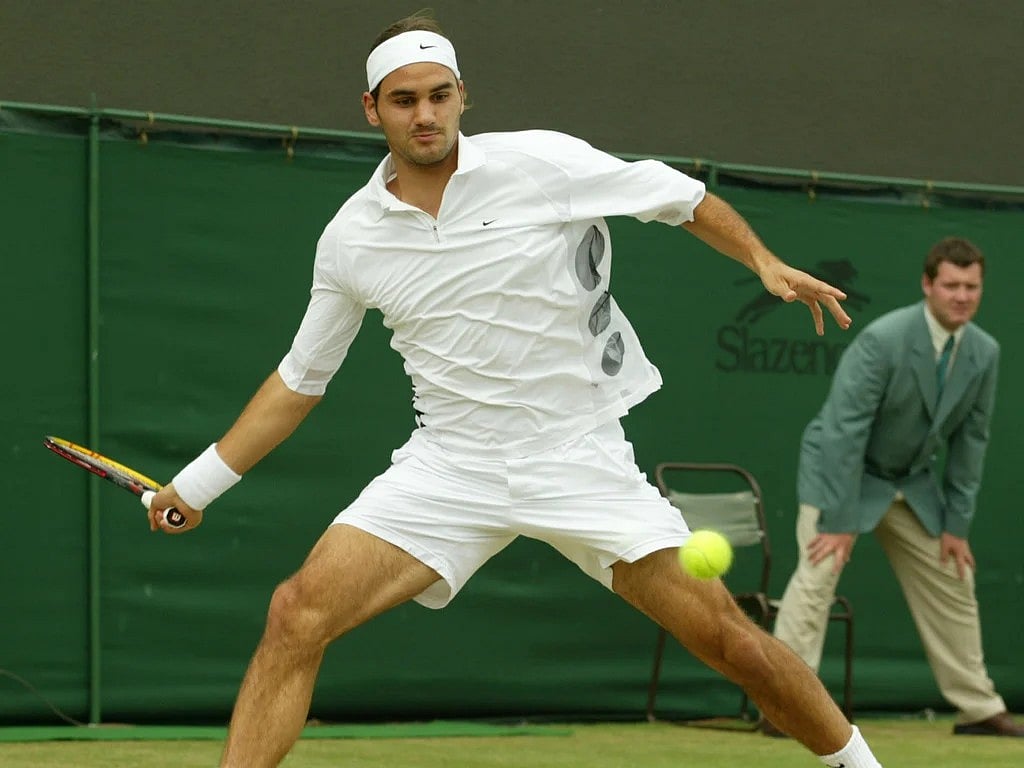 FILE - Switzerland's Roger Federer plays at Wimbledon, July 3, 2003.