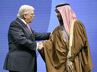 US President Donald Trump shakes hands with Crown Prince and Prime Minister of the Kingdom of Saudi Arabia Mohammed bin Salman at the US-Saudi Investment Forum at the John F. Kennedy Center for the Performing Arts in Washington, DC on November 19, 2025. 