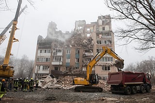 Ukrainian rescue personnel operate at the site of a heavily damaged residential building following Russian air strike in the city of Ternopil, on November 20, 2025, amid the Russian invasion of Ukraine.