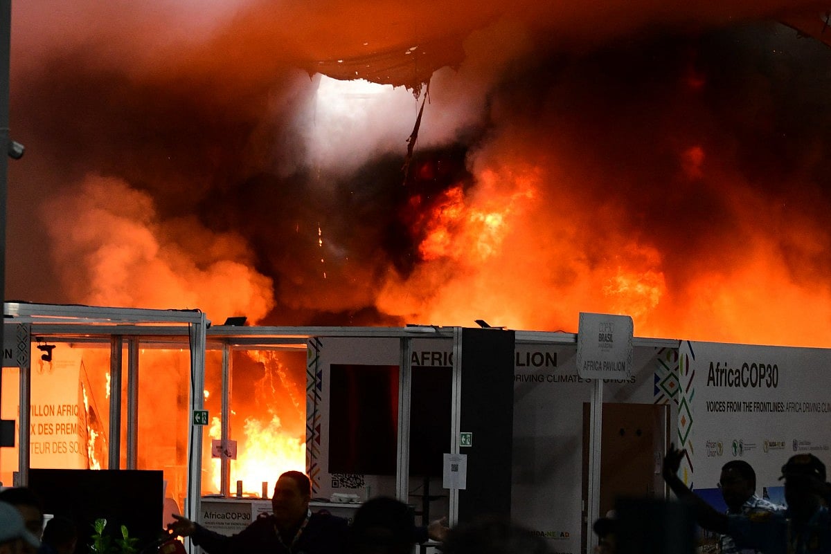 A fire burns in a pavilion during the COP30 UN Climate Change Conference in Belem, Para state, Brazil, on November 20, 2025.