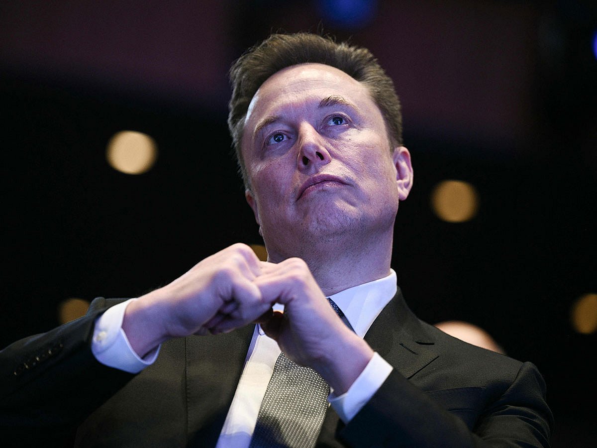 Elon Musk looks on as US President Donald Trump speaks at the US-Saudi Investment Forum at the John F. Kennedy Center for the Performing Arts in Washington, DC on November 19, 2025. (Photo by Brendan SMIALOWSKI / AFP)