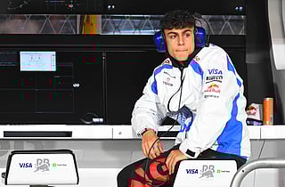 Arvid Lindblad of Great Britain and Visa Cash App Racing Bulls on the pit wall during practice ahead of the F1 Grand Prix of Las Vegas at Las Vegas Strip Circuit on November 20, 2025 in Las Vegas, Nevada.