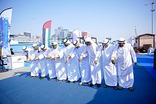 Emirati traditional dancers welcome visitors at the Abu Dhabi International Boat Show, showcasing the UAE’s rich cultural heritage.
