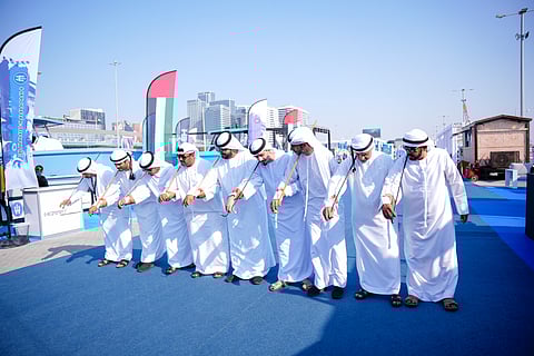 Emirati traditional dancers welcome visitors at the Abu Dhabi International Boat Show, showcasing the UAE’s rich cultural heritage.