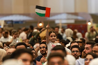 A young girl waves the UAE flag at the ‘Emirates Loves Syria’ event in Expo City Dubai.