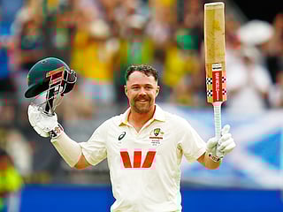 Australia's Travis Head celebrates his century on day two of the first Ashes Test against England in Perth, on Saturday, November 22, 2025.