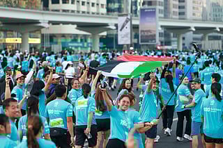 Sheikh Zayed Road filled with hundreds of thousands of people, all wearing the same blue jersey for Dubai Run.