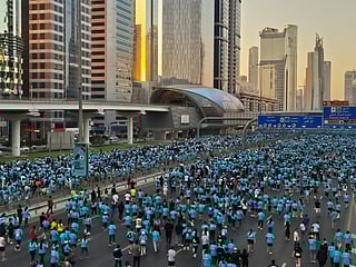 Tens of thousands flood Sheikh Zayed Road at sunrise, turning it into a vibrant river of colour and movement for Dubai Run 2025.