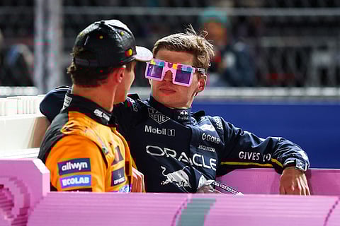 Race winner Max Verstappen of the Netherlands and Oracle Red Bull Racing and Second placed Lando Norris of Great Britain and McLaren in a Lego pink Cadillac in parc ferme during the F1 Grand Prix of Las Vegas at Las Vegas Strip Circuit on November 22, 2025 in Las Vegas, Nevada.