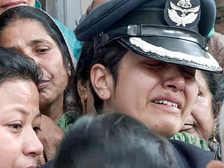 Wing Commander Afshan breaks down ahead of last rites of her husband Wing Commander Namansh Syal, who lost his life in Tejas aircraft accident at the Dubai Airshow, in Kangra on Sunday. 