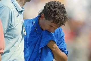 Italy's Roberto Baggio wipes his face after his team was defeated after the final match between Brazil and Italy of the 15th World Cup football at Rose Bowl stadium in Pasadena on July 17, 1994.