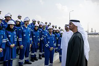 President His Highness Sheikh Mohamed bin Zayed Al Nahyan speaks with ADNOC employees after an ADNOC Board of Directors meeting, at Habshan Complex. Seen with Dr Sultan bin Ahmed Al Jaber, UAE Minister of Industry.