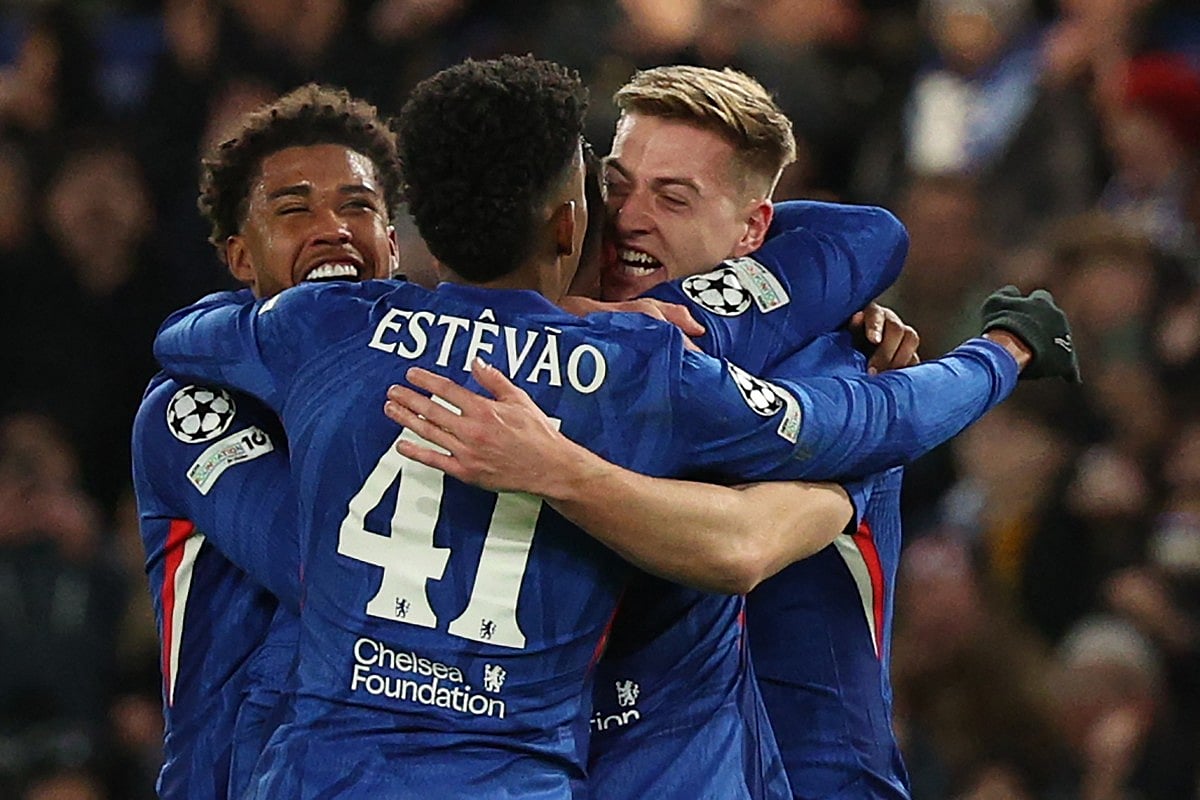 Chelsea's English striker #09 Liam Delap (R) celebrates with teammates after scoring their third goal during the UEFA Champions League league-phase football match between Chelsea and Barcelona at Stamford Bridge in London on November 25, 2025.