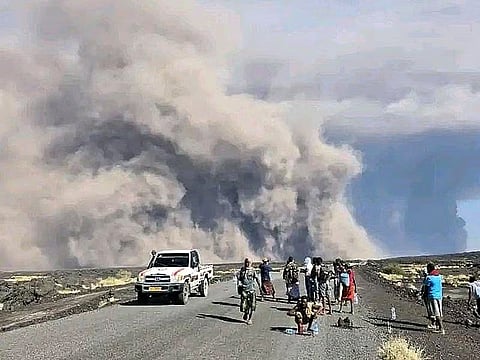In this photo released by the Afar Government Communication Bureau, ash billows from an eruption of the long-dormant Hayli Gubbi Volcano in Ethiopia's Afar region. 