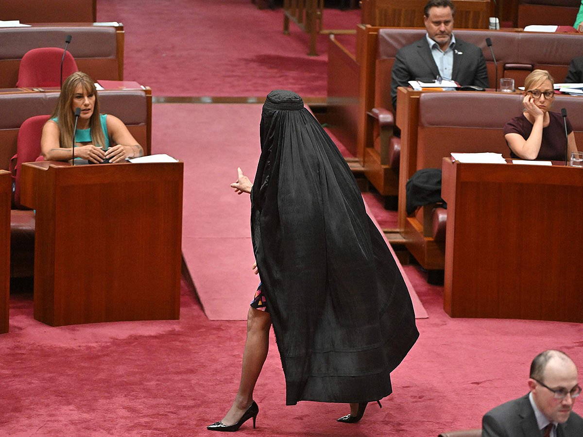 One Nation Leader Pauline Hanson wears a burqa in the Senate chamber at Parliament House in Canberra, Monday, Nov. 24, 2025.
