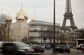 The Holy-Trinity Russian orthodox Cathedral and the adjoining culture center, right, are seen next to the Eiffel Tower in Paris, Wednesday, Nov. 26, 2025. 