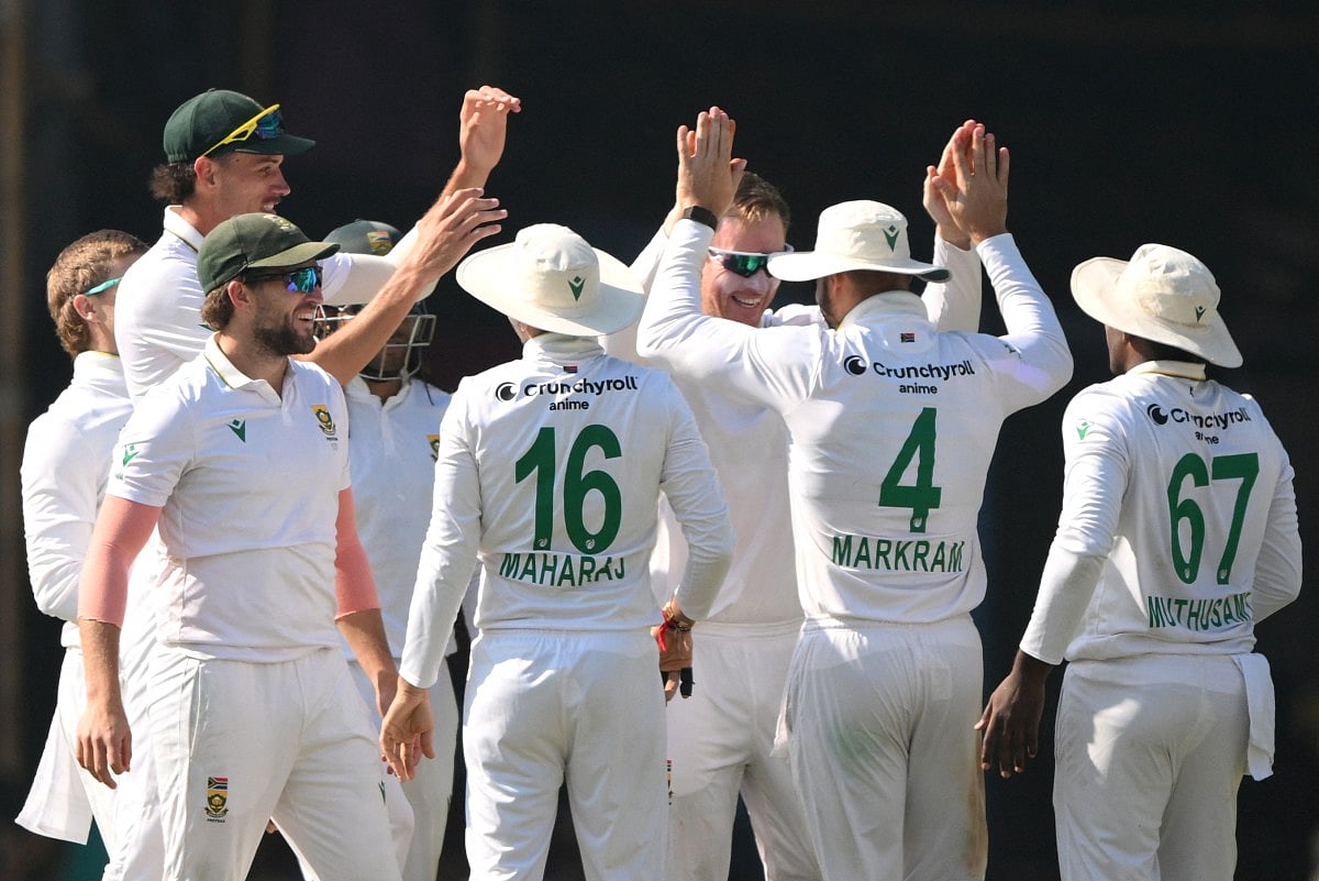 South Africa's players celebrate after the dismissal of India's Rishabh Pant during the fifth day of the second Test cricket match against India at the Barsapara Cricket Stadium in Guwahati on November 26, 2025.