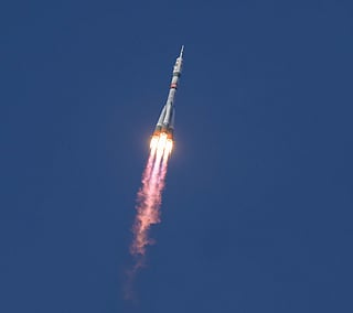 In this handout photograph taken and released by NASA, a Soyuz 2.1a booster rocket with the Soyuz MS-28 spacecraft carrying the Expedition 74 crew of Roscosmos cosmonauts Sergey Kud-Sverchkov and Sergei Mikaev and NASA astronaut Chris Williams, blasts off to the International Space Station (ISS) from the Russian-leased Baikonur cosmodrome in Kazakhstan. File photo taken on November 27, 2025.