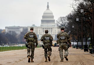 National Guard patrol along the National Mall in front of the Capitol, Wednesday, Nov. 26, 2025, in Washington. 