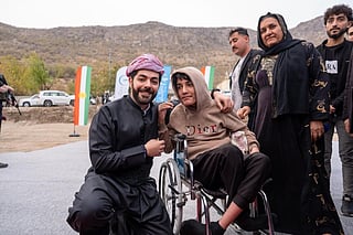 Kurdish businessman and philanthropist Idris Nechirvan Barzani with community members during the launch of solar project.