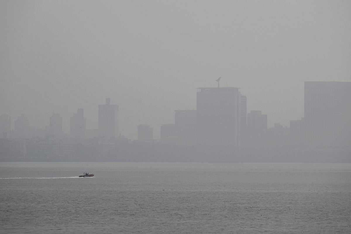A speedboat is pictured in the Arabian sea amidst smog in Mumbai on November 28, 2025.