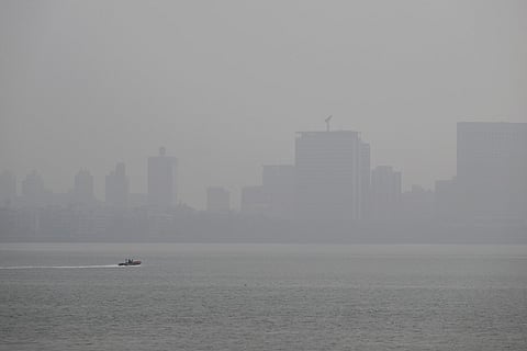 A speedboat is pictured in the Arabian sea amidst smog in Mumbai on November 28, 2025.