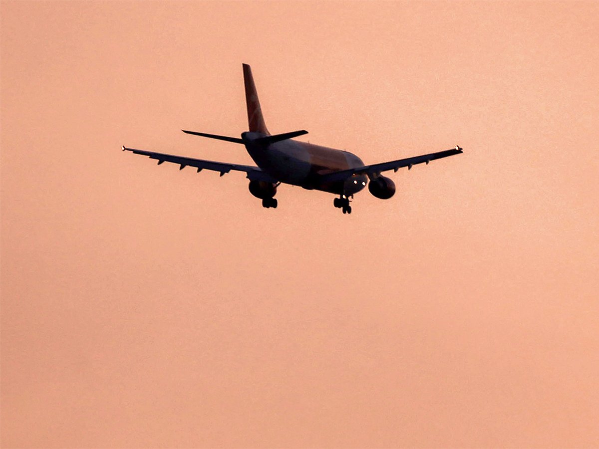 File photo: An Airbus A320 aircraft of Iranian airline Qeshm Air flies over Shamiya district on its landing approach to Najaf International Airport in central Iraq.