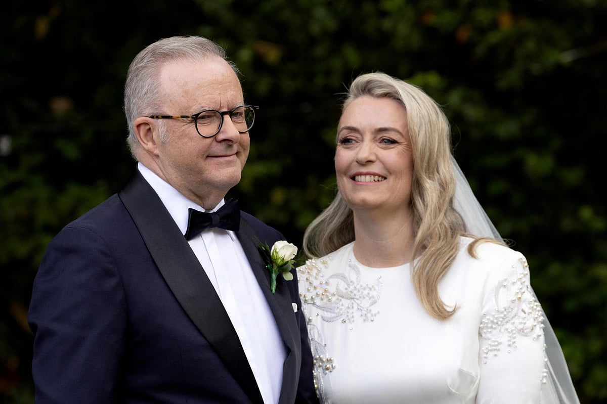Australias Prime Minister Anthony Albanese and his new wife Jodie Haydon stand together during their wedding ceremony in Canberra on November 29, 2025.  
