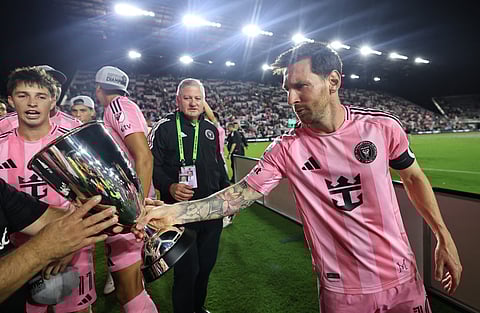 Lionel Messi #10 of Inter Miami CF celebrates with the Champion's trophy after winning the the Audi 2025 MLS Cup western conference final match between Inter Miami CF and New York City FC at Chase Stadium on November 29, 2025 in Fort Lauderdale, Florida.