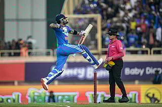 India's Virat Kohli celebrates after scoring a century (100 runs) during the first one-day international (ODI) cricket match between India and South Africa at the JSCA International Stadium in Ranchi on November 30, 2025.