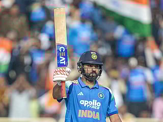 India's Rohit Sharma celebrates after scoring a half-century  during the first ODI match against South Africa at the JSCA International Stadium in Ranchi on November 30, 2025. 