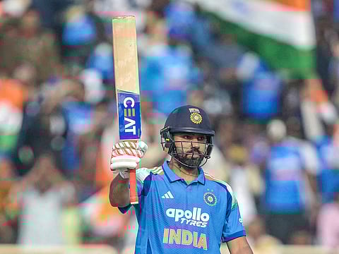 India's Rohit Sharma celebrates after scoring a half-century  during the first ODI match against South Africa at the JSCA International Stadium in Ranchi on November 30, 2025. 