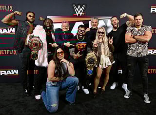 Trick Williams, Kofi Kingston, Ted Sarandos, Co-CEO, Netflix, Raquel Rodriguez, Jey Uso, Nick Khan, President of WWE, Liv Morgan, Austin Theory, and Grayson Waller attend Netflix & WWE "Monday Night RAW" Brunch at MGM Grand Hotel & Casino on April 21, 2025 in Las Vegas, Nevada.