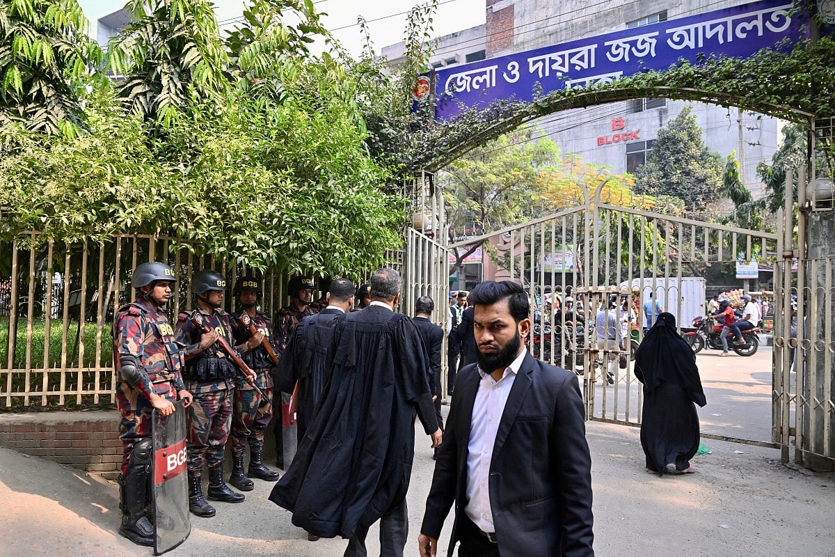 Border Guard Bangladesh (BGB) personnel stand guard outside a court in Dhaka on December 1, 2025.