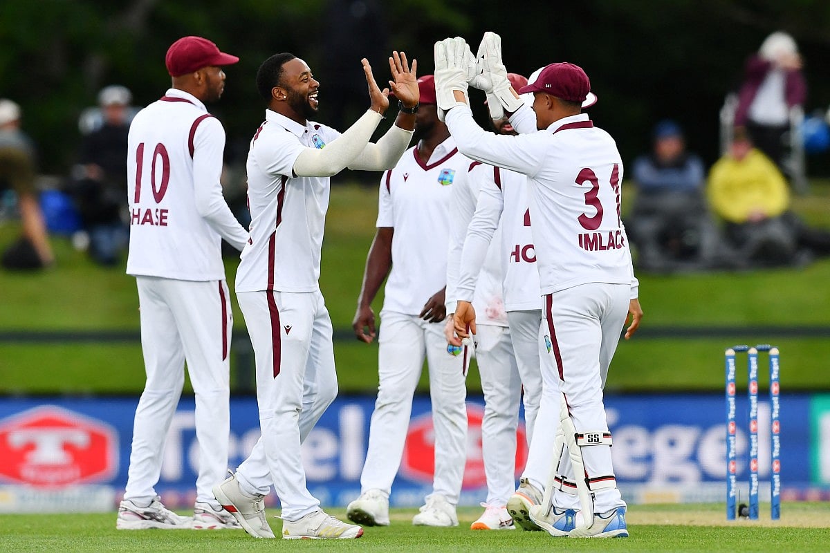 West Indies' Ojay Shields (2nd L) celebrates the wicket of New Zealand's Michael Bracewell with his teammates during day one of the first Test cricket match at Hagley Oval in Christchurch on December 2, 2025.