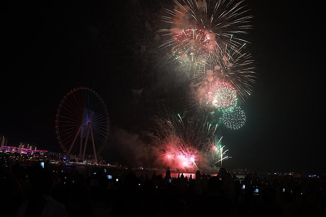 A cascade of golden sparks illuminates the sky above JBR as residents gather for the city’s National Day show.