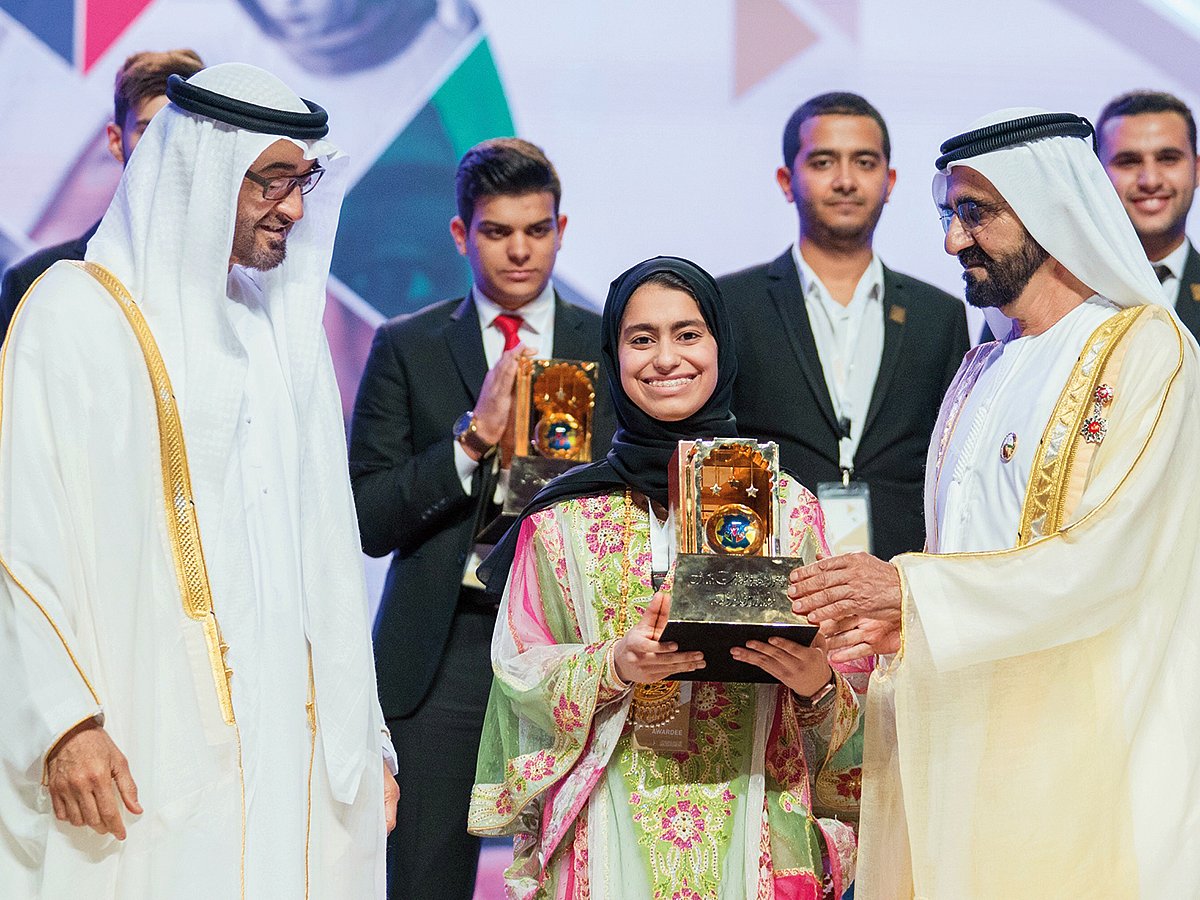 President His Highness Sheikh Mohamed Bin Zayed Al Nahyan and His Highness Sheikh Mohammed Bin Rashid Al Maktoum, Vice-President and Prime Minister of the UAE and Ruler of Dubai, present the Sheikha Fatima Bint Mubarak International Arab Youth Award to Fatima Al Kaabi for excellence in science.