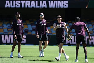 England’s players play with a fooball during a training session at The Gabba in Brisbane on December 2, 2025, ahead of the second Ashes cricket Test.