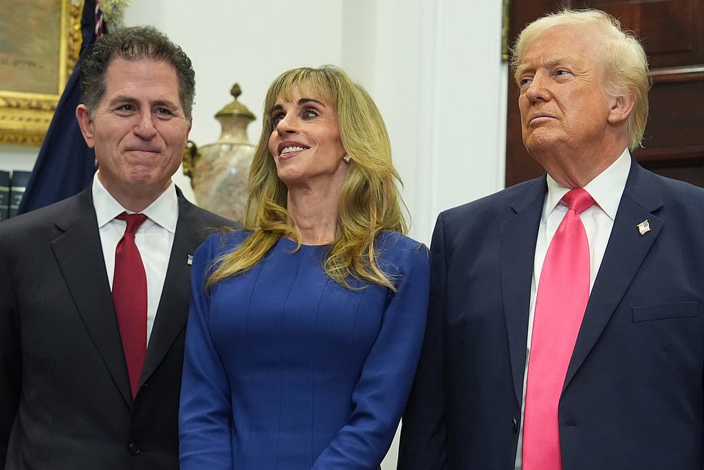 Michael Dell, left, his wife Susan and President Donald Trump listen during an event on "Trump Accounts" for kids in the Roosevelt Room of the White House, Tuesday, Dec. 2, 2025, in Washington.