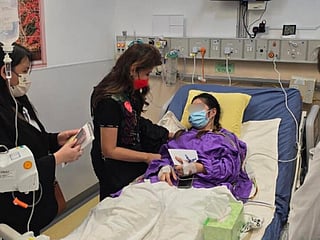 Philippine Senator Imee Marcos visited Rhodora Alcaraz in the hospital.